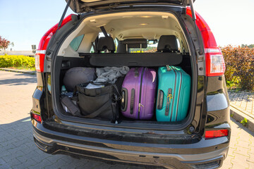 Suitcases and luggage in the trunk of the car ready to go on vacation