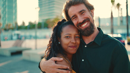 Close-up portrait of happy interracial couple in the port, backlighting Closeup, young woman and...