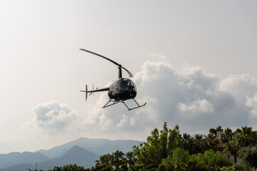 Fototapeta na wymiar Helicopter flying low, ready to land.
