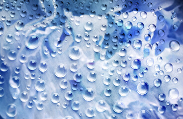 abstract background in blue and green colors with glass and drops of water 