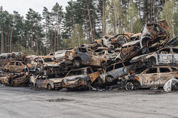 Landfill of burned cars. The cars were destroyed as a result of hostilities