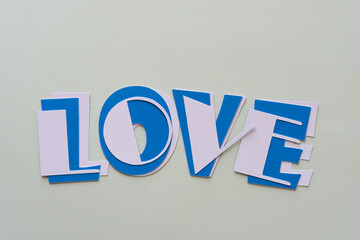 the word love isolated on a gray paper background