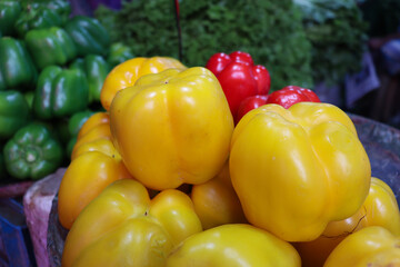 multiple colored capsicum stock on shop