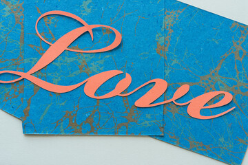 orange love letters on marbled blue paper