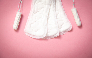 Menstrual pad on a pink background.