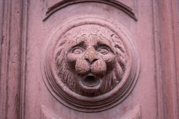 Old door knocker with lion face