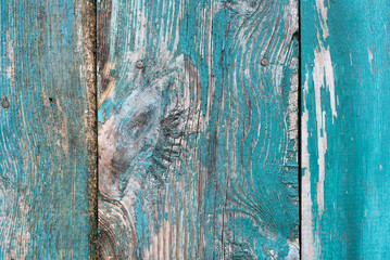 Old blue wooden fence background with scratches 