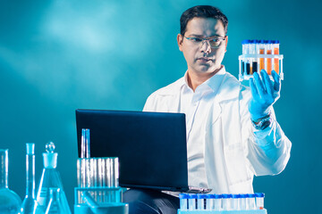 Chemical examination of food. Chemist conducts a test. Researcher studies the results of the experiment. Chemical laboratory. Chemist in a protective mask and glasses. Respiratory protection.
