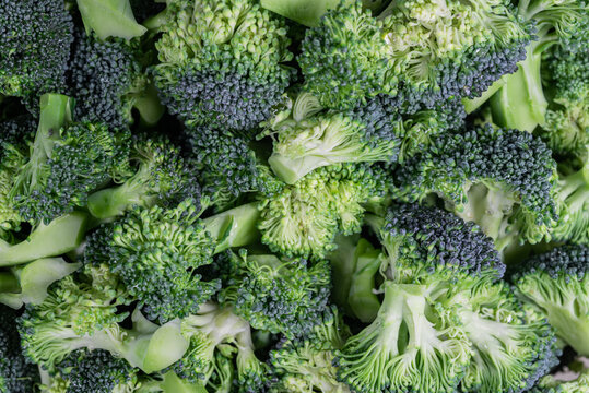 Broccoli texture,  close-up image,  small pieces of raw vegetable in a bowl