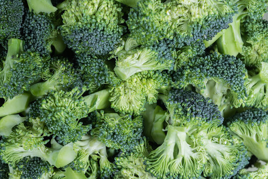 Broccoli texture,  close-up image,  small pieces of raw vegetable in a bowl