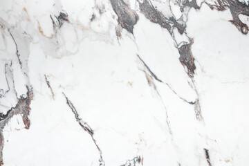 White marble stone texture top view. abstract pattern with grey and brown streaks for background or design art