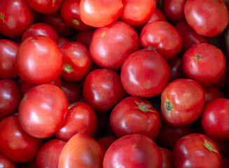 Red tomatoes top view in the store. Pattern, background
