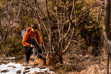 Going up the hill with the dog together while enjoying their time