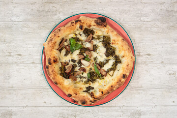 Italian handmade fresh pizza on wooden table high angle view