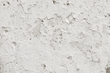 Crashed white wall background, a surface of old weathered plastered wall texture