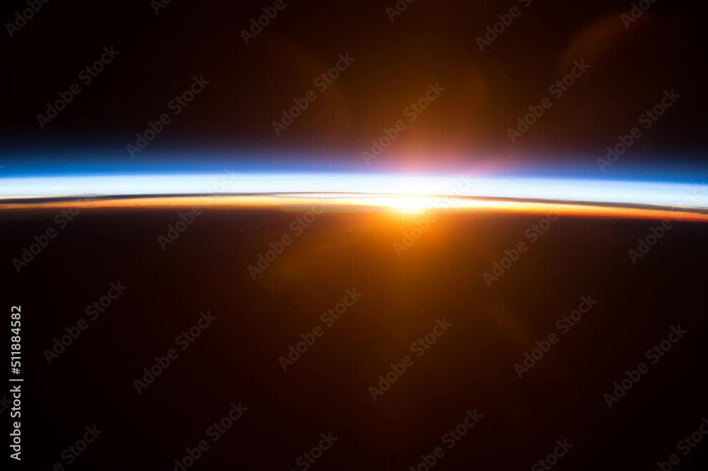 Wall mural colorful sunrise motion background. elements of this image furnished by nasa.
