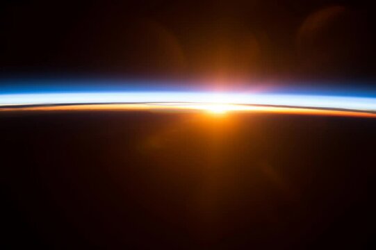Colorful Sunrise motion background. Elements of this image furnished by NASA.
