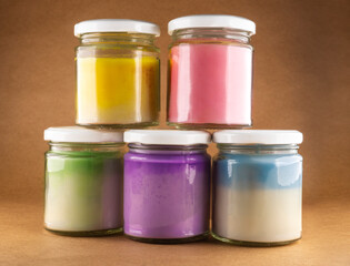 colorful jars with natural soy wax candles.