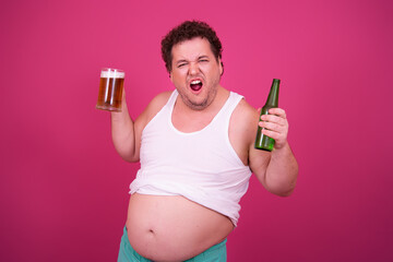Funny fat man drinks light beer.