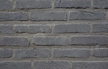 Gray brick wall. Wall with gray bricks and gray joints. Background.