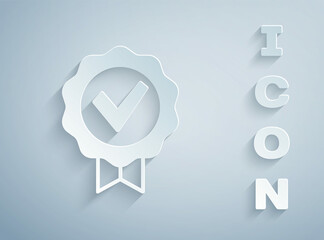 Paper cut Approved or certified medal and check mark icon isolated on grey background. Paper art style. Vector