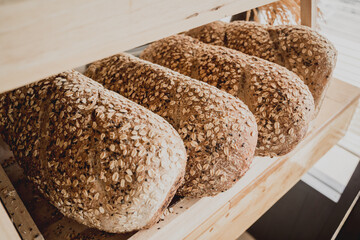 Fresh homemade bread from whole grain flour with the oatmeal flakes