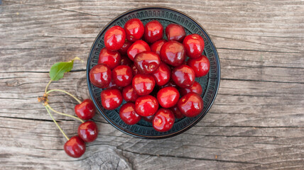 cherry , sweet cherry in a bowl on table