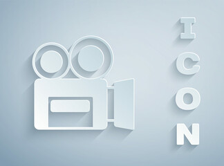 Paper cut Retro cinema camera icon isolated on grey background. Video camera. Movie sign. Film projector. Paper art style. Vector