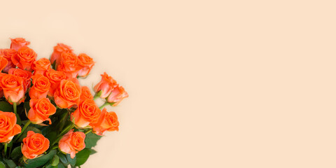 Bouquet of orange roses and empty space for your text. Selective focus. Banner