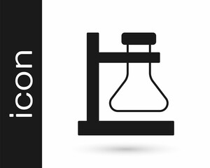 Black Glass test tube flask on stand icon isolated on white background. Laboratory equipment. Vector