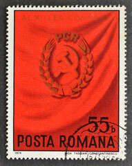 Cancelled postage stamp printed by Romania, that shows Party badge, 9th Romanian Communist Party...