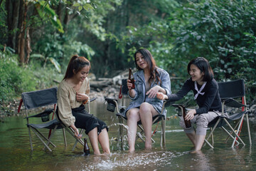 group of Asian girls enjoying a day at the  during holiday camping