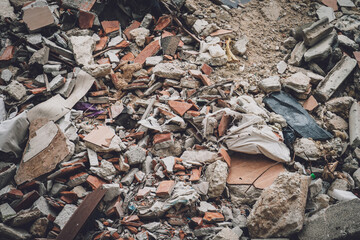 Waste plastic bottles and other types of waste at the ground