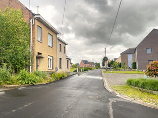 Car window view over a residential neighborhood in Belgium