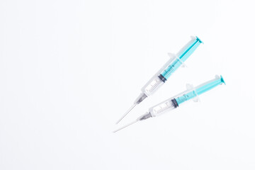Medical plastic vaccination syringe isolated on a white background