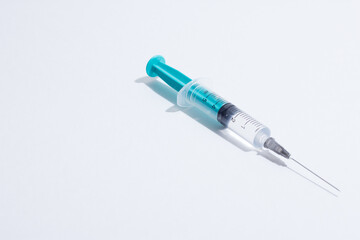 Medical plastic vaccination syringe isolated on a white background