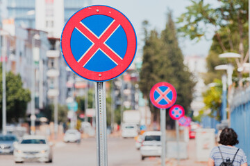 Many Road signs prohibiting parking and stopping. Traffic laws and urban development