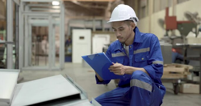 Factory workers are checking the quality of products in the production line.