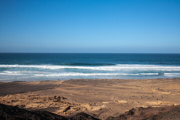 View on a volcanic coastline Playa de Cofete Canary Islands 