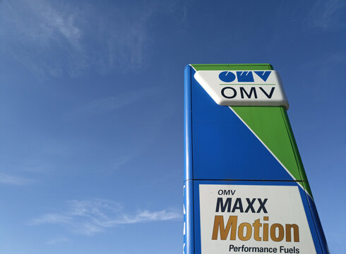 Sign of the network of gas stations OMV against the sky