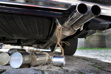 Just married - tin cans attached to exhaust pipes with strings.