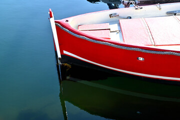 Red fishing boat in a marina