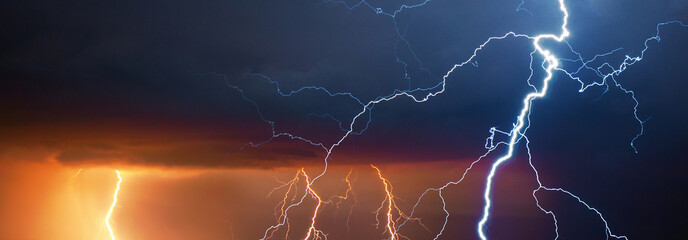 Fork lightning striking down during summer storm