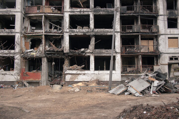 The entrance and the lower floors of a residential building destroyed by a rocket explosion. Consequences of the war in Ukraine