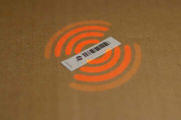 Used RFID sticker or tag on a brown surface