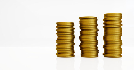 3D golden coins stacks in white background. 3D render.