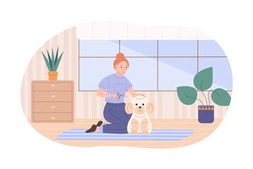 Woman pet owner making haircut for her dog