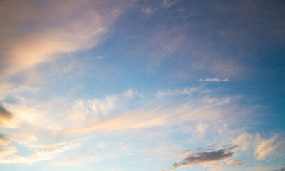 Summer sky. Cumulus clouds on a blue background. Partly cloudy.