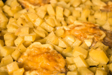 Sliced baked potato with cutlet and cheese crust