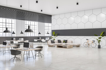 Perspective view on sunlit open space office with monochrome interior design, glossy floor, cells printed concrete walls, wooden tables and big lattice windows. 3D rendering